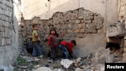 Children play in the old city of Aleppo, Syria, Feb. 4, 2014.