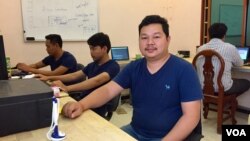 Meach Sophanith, 29, team lead of The Coder Studio, a technology startup, and colleagues work in their company’s small office in Battambang City, Battambang Province, February 16, 2017. The Coder Studio is an eight-month old, eight-member team and one of the first technology startups based in Cambodia’s agricultural province of Battambang. (Sophat Soeung/VOA Khmer) 