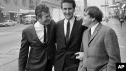 The Kingston Trio - Bob Shane, left, John Stewart, center, and Nick Reynolds, right, poses in Hollywood in 1967 after announcing they are giving up the act. Their reason: the public won’t let them sing anything but "Tom Dooley."