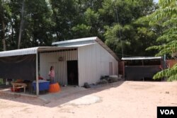 In Rotha, 27, stands at her newly-built house in Kampong Tralach district, Kampong Chhnang province, Cambodia, Oct 15, 2019. (Phorn Bopha/VOA Khmer)