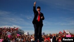 Republican U.S. presidential nominee Donald Trump rallies with supporters at the Million Air Orlando airplane hangar in Sanford, Florida, U.S. Oct. 25, 2016.