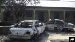 Burnt our cars are seen at the business and skills center following attacks by the Boko Haram sect in Potiskum, Nigeria, October 20, 2012.