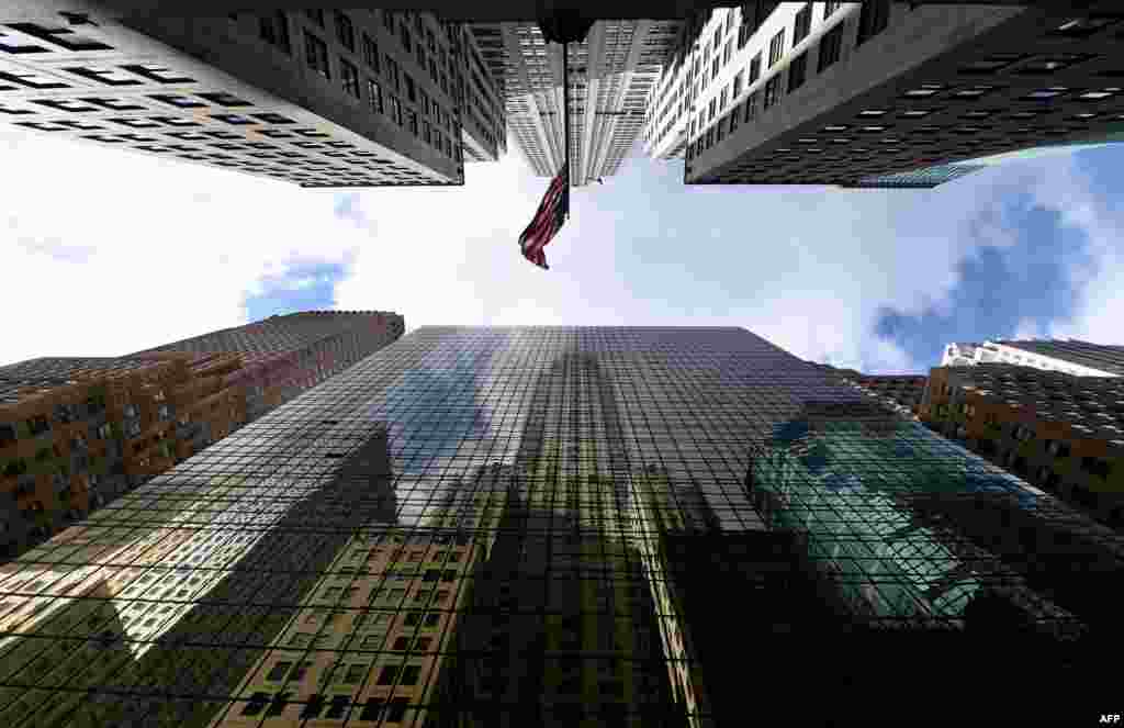 The Chrysler Building is reflected in the side of the Grand Hyatt Hotel in midtown Manhattan, New York City. Cold air is still in the area with temperatures are expected to be only reaching 30 (-1C) on Saturday