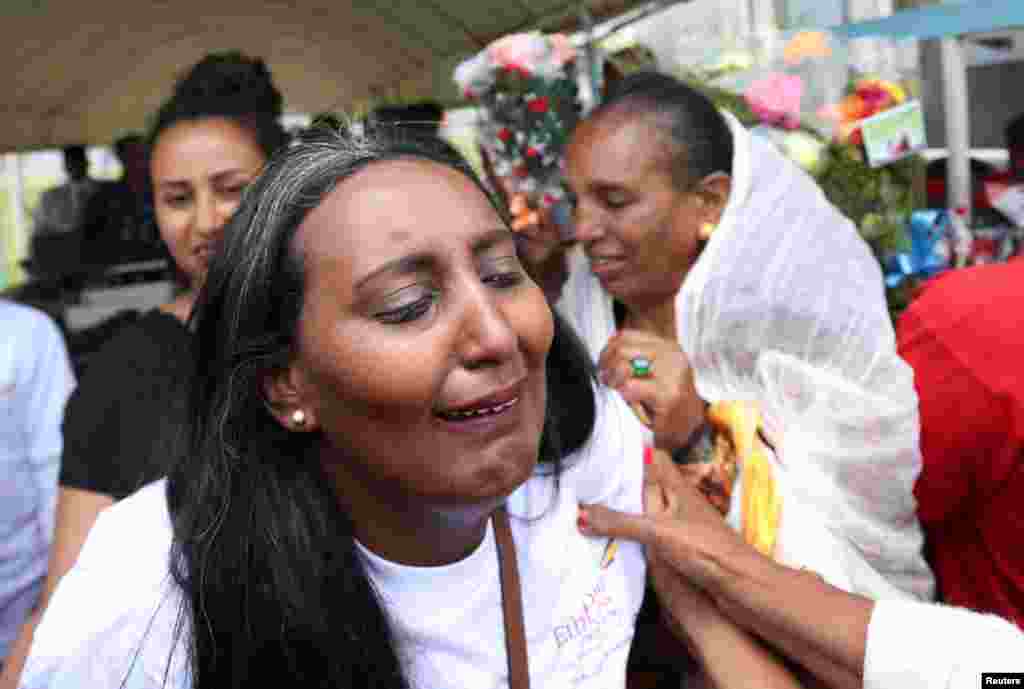 Eritreans wait to welcome their families at Asmara International Airport