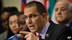 Venezuelan Foreign Affairs Minister Jorge Arreaza speaks during a news conference surrounded by supporting diplomats from several countries at U.N. headquarters, Feb. 14, 2019.