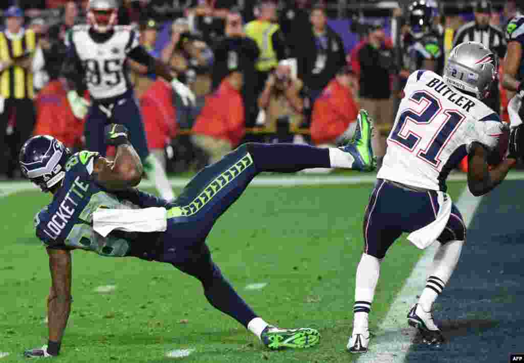 Malcolm Butler (R) of the New England Patriots intercepts a pass intended for Ricardo Lockette (L) of the Seattle Seahawks late in the fourth quarter of Super Bowl XLIX at University of Phoenix Stadium in Glendale, AZ.