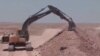 An Iraqi excavator digs a trench outside of Baghdad, which government officials say is a security measure, Feb. 9, 2016. (Courtesy of Salah Bamarni)