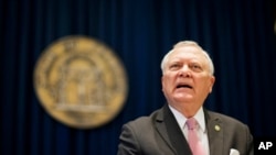 Georgia Governor Nathan Deal during a press conference in Atlanta to announce he has vetoed legislation allowing clergy to refuse performing gay marriage and protecting people who refuse to attend the ceremonies, March 28, 2016.