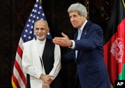 FILE - Kerry meets with Afghanistan's presidential candidate Ashraf Ghani Ahmadzai at the U.S. Embassy in Kabul, July 11, 2014.
