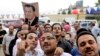 Supporters of former Egyptian President Hosni Mubarak gather outside the Maadi Military Hospital, in Cairo, Egypt, May 4, 2014.