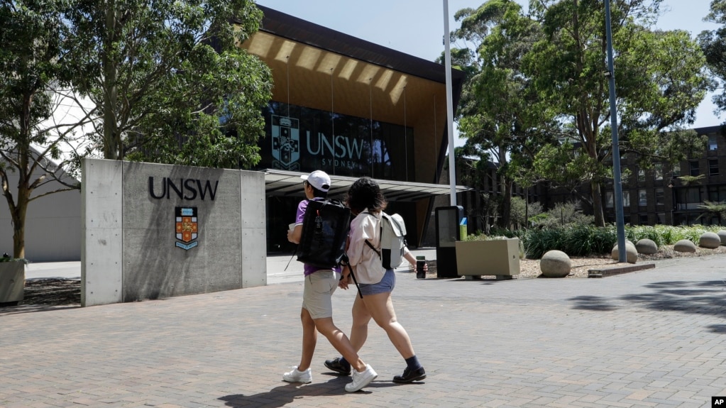 FILE - In this Dec 1, 2020, file photo, students walk around the University of New South Wales campus in Sydney, Australia. (AP Photo/Mark Baker, File)
