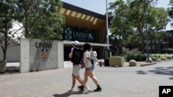 FILE - In this Dec 1, 2020, file photo, students walk around the University of New South Wales campus in Sydney, Australia. (AP Photo/Mark Baker, File)