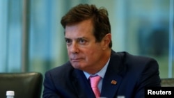 FILE - Paul Manafort, at the time chairman of Donald Trump's presidential campaign, attends a round table discussion on security at Trump Tower in New York, Aug. 17, 2016.