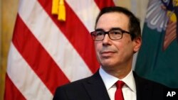 FILE - U.S. Treasury Secretary Steven Mnuchin is seen during a ceremony at the Treasury Department in Washington, Nov. 27, 2017.