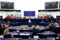 European Commission President Ursula von der Leyen delivers a speech during a plenary session at the European Parliament in Strasbourg, eastern France, Dec. 15, 2021.