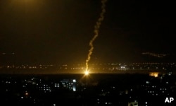 Flares fired from Israeli forces light up the night sky in Gaza City, Nov. 12, 2018, as the Israeli military launched fighter jets to strike "terror targets" throughout the Gaza Strip.