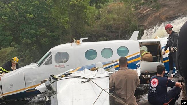 This handout photo released by Minas Gerais Civil Police shows the crashed airplane that was transporting Brazilian singer Marilia Mendonca, in the southeastern state of Minas Gerais Brazil, Nov. 5, 2021.