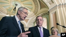 Senate Majority Leader Harry Reid, D-Nev., (L), joined by Majority Whip Dick Durbin D-Ill., (C), and Sen. Patty Murray, D-Wash., (R), speaks to reporters following a budget vote late in the day, at the Capitol in Washington, DC, May 25, 2011