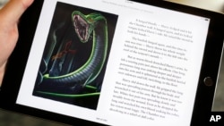 Text and an illustration from "Harry Potter and the Chamber of Secrets" are displayed on an iPad, Sept. 30, 2015, in New York.