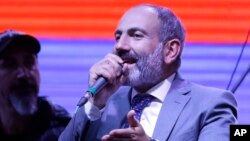 Opposition lawmaker Nikol Pashinian addresses the crowd gathered in Republic Square during a concert in Yerevan, Armenia, May 7, 2018.