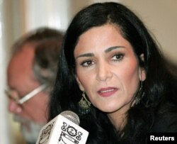 FILE - Journalist and activist Lydia Cacho listens during a conference in Mexico City, Feb. 17, 2006.
