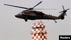 A U.S. Army helicopter prepares to land after a ceremony givng notice of the official return of the U.S. Army's 23rd chemical battalion to South Korea, Uijeongbu, April 4, 2013. 