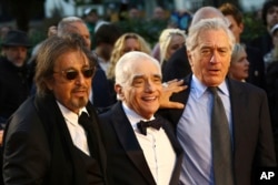 Actor Al Pacino, from left, director Martin Scorsese and actor Robert De Niro pose for photographers upon arrival at the premiere of the film 'The Irishman' as part of the London Film Festival, in central London, Sunday, Oct. 13, 2019.