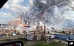 This image made from video shows an explosion ripping through the San Pablito fireworks' market in Tultepec, Mexico, Dec. 20, 2016.