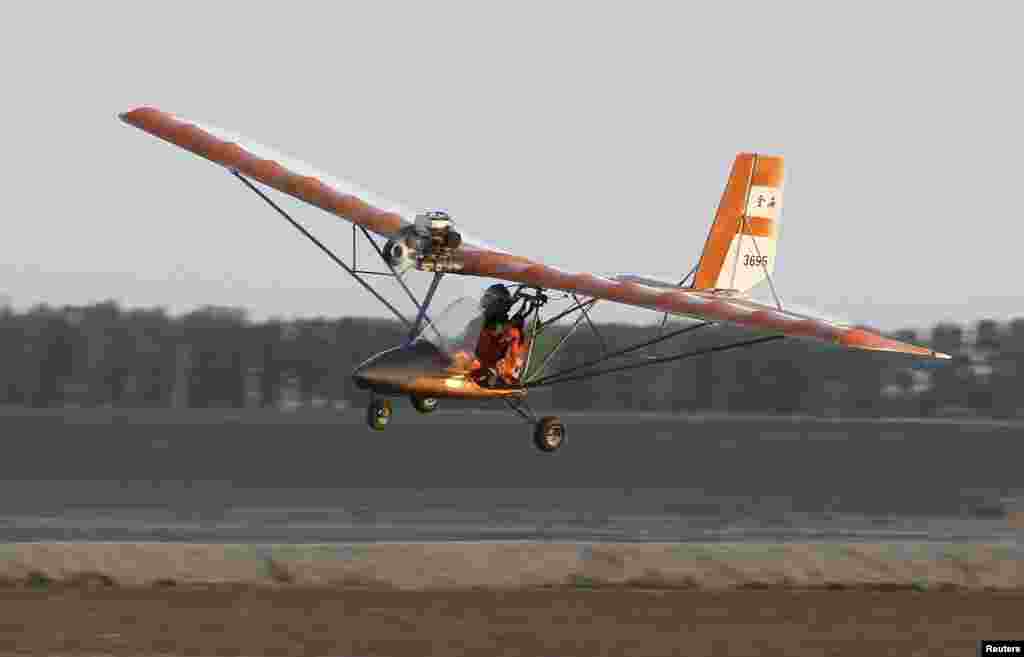 Yang Shijun, 45-year-old manager of a construction materials company, flies his homemade plane during a test run in Changchun, Jilin province, China.