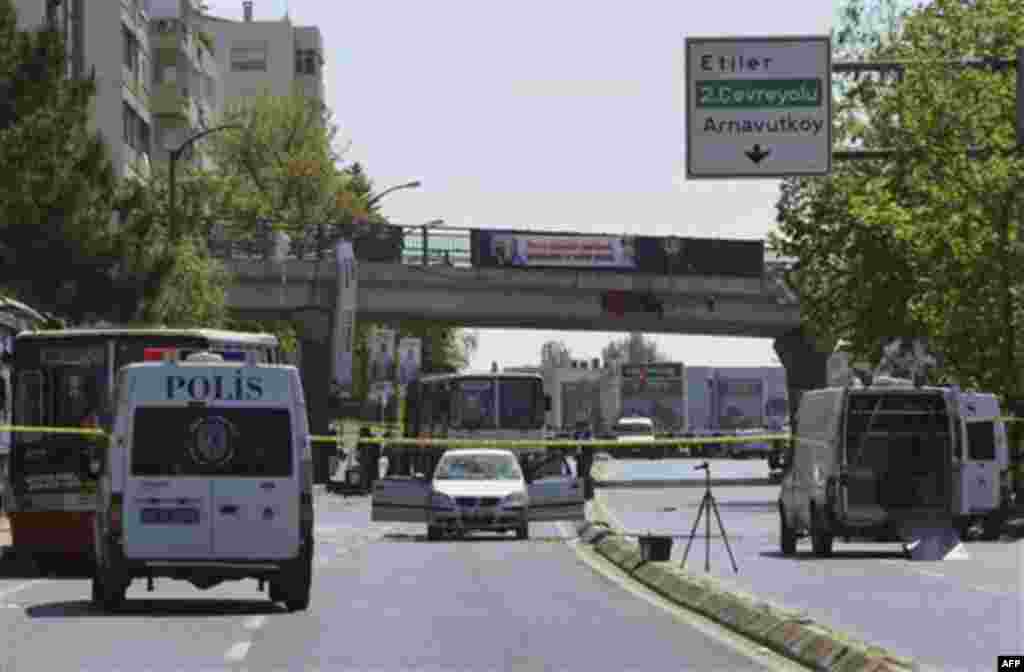 Security members and forensic experts work at the scene after a bomb exploded at a bus stop during rush hour in Istanbul, Turkey, Thursday, May 26, 2011. Seven people were injured as several ambulances rushed to the scene on a multi-lane thoroughfare in a