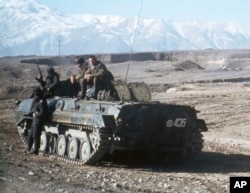 Soviet heavy armor is shown on the snowy foothills in Afghanistan at a small encampment near Kabul, Jan. 7, 1980, after elements of the Soviet armed forces made their controversial entry into Afghanistan territory.