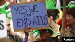 AIDS activists take part in a rally across from the White House in Washington, D.C., where the international AIDS 2012 conference is currently being held, July 24, 2012. 