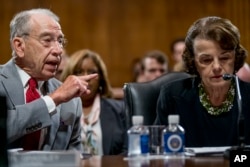 Senate Judiciary Committee Chairman Chuck Grassley, R-Iowa, left, accompanied by Sen. Dianne Feinstein, D-Calif., the ranking member (R), speaks during a Senate Judiciary Committee markup meeting on Capitol Hill, Sept. 13, 2018, in Washington.