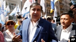 Former Georgian president and former governor of the Ukrainian Odessa region Mikhail Saakashvili surrounded by his supporters at a rally near the Justice Ministry in Kyiv, Ukraine, May 30, 2017. 