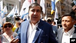 Mikhail Saakashvili, former Georgian president and former governor of the Ukrainian Odessa region, is surrounded by his supporters at a rally near the Justice Ministry in Kyiv, Ukraine, May 30, 2017. Saakashvili was stripped of his Ukrainian citizenship Wednesday.