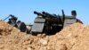 A member of Misrata forces, under the protection of Tripoli's forces, takes his position near a military camp in Tripoli, Libya, April 9, 2019.