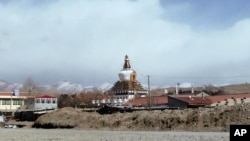 In this photo taken on Monday, Feb. 27, 2012, Stupa of Kirti monastery, the largest Tibetan monastery is seen in Aba prefecture, in China's Sichuan province. China's stifling lockdown of this Tibetan monastery town has not only been about patrolling its o