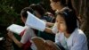 FILE - Students prepare for an exam in suburbs of Yangon, Myanmar, Feb. 19, 2016. 