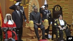 Former Ghanaian Vice President John Mahama is seated after being sworn in as President, July 24, 2012.