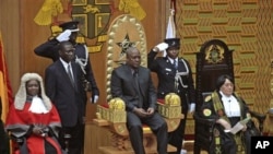 Former Ghanaian Vice President John Mahama is seated after being sworn in as President, July 24, 2012.