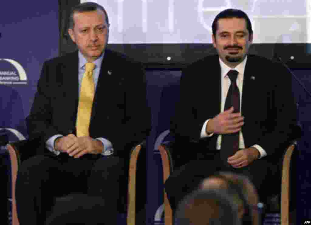 Lebanese Prime Minister Saad Hariri, right, and his Turkish couterpart Recep Tayyip Erdogan, left, attend the Union of Arab Banks annual meeting in Beirut, Lebanon, Thursday, Nov. 25, 2010. Bank deposits in the Arab world are on track to grow over 40 perc