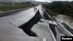 A damaged road is seen after a quake at Tarahuin, on Chiloe island, southern Chile, Dec. 25, 2016. 