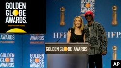 Helen Hoehne, president of the Hollywood Foreign Press Association, left, and Snoop Dogg, pose following the nominations event for 79th annual Golden Globe Awards at the Beverly Hilton Hotel, Dec. 13, 2021, in Beverly Hills, Calif.