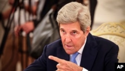 (File) U.S. climate envoy John Kerry gestures while speaking to Russian Foreign Minister Sergey Lavrov during their meeting in Moscow, Russia, Monday, July 12, 2021.(Dimitar Dilkoff/Pool Photo via AP)