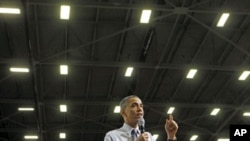 US President Barack Obama takes questions during a town hall discussion about clean energy while visiting Gamesa Technology Corporation in Fairless Hills, Pennsylvania, April 6, 2011