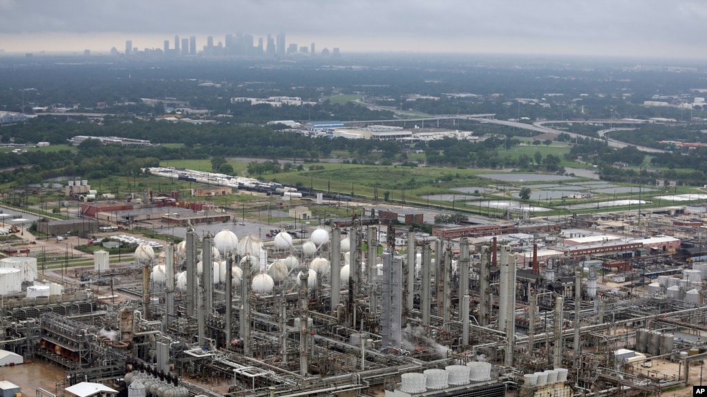 This aerial photo shows the TPC petrochemical plant near downtown Houston, background, on Tuesday, Aug. 29, 2017.