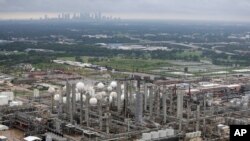 This aerial photo shows the TPC petrochemical plant near downtown Houston, background, on Tuesday, Aug. 29, 2017.