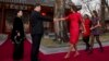 U.S. first lady Michelle Obama, followed by her daughters Malia and Sasha, is greeted by Chinese President Xi Jinping and his wife Peng Liyuan at the Diaoyutai State guest house in Beijing, March 21, 2014.