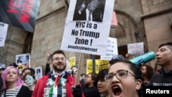 Protesters demonstrate against Republican U.S. presidential candidate Donald Trump in midtown Manhattan in New York City, April 14, 2016.