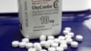 FILE - OxyContin pills are shown at a pharmacy in Montpelier, Vermont, Feb. 19, 2013.